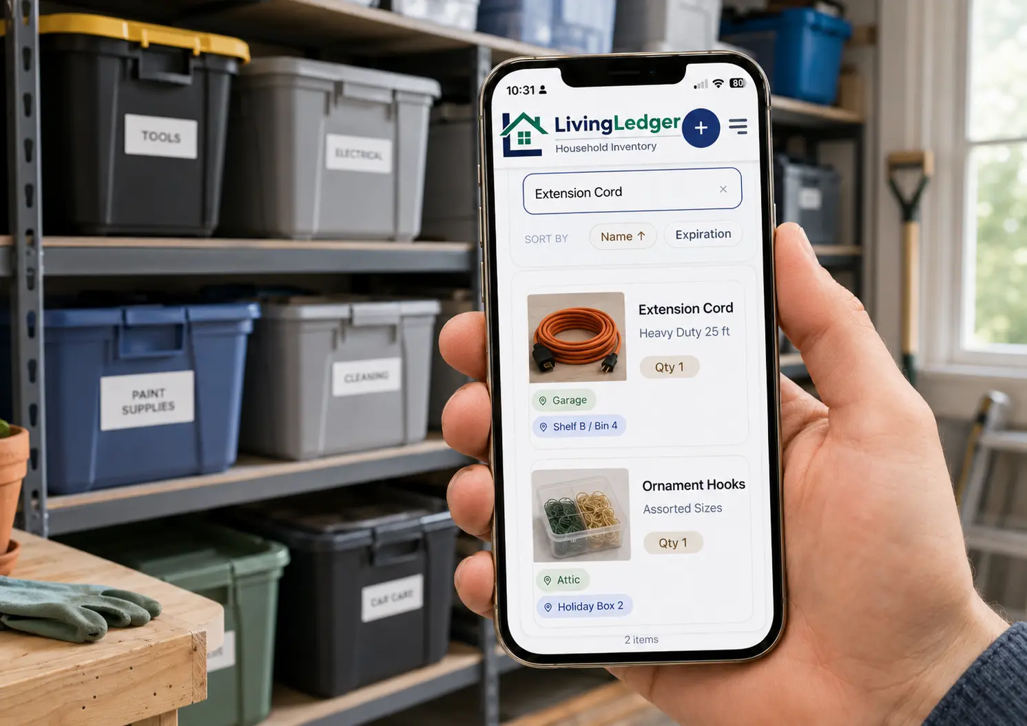 LivingLedger storage bin inventory app showing a phone search for extension cords next to garage shelving